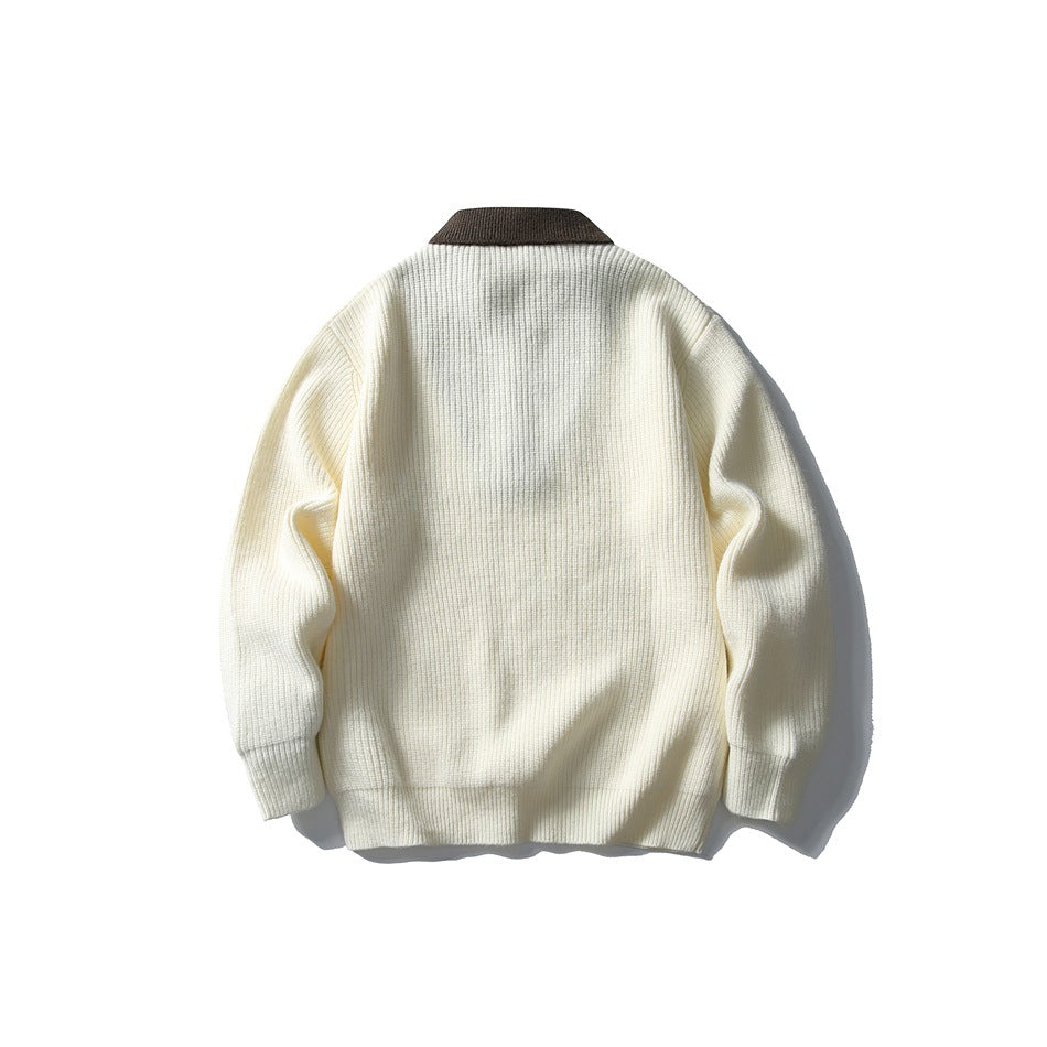 Back view of cream ribbed-knit sweater with brown collar, flat lay