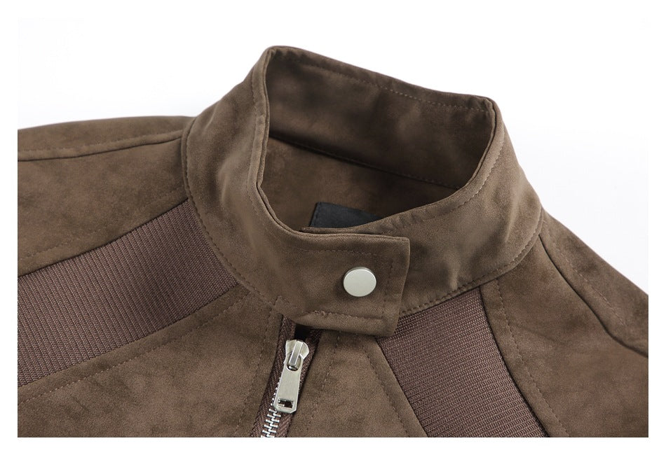 Close-up of a brown jacket with a stand collar, silver snap, front zipper, and dark textured trim.