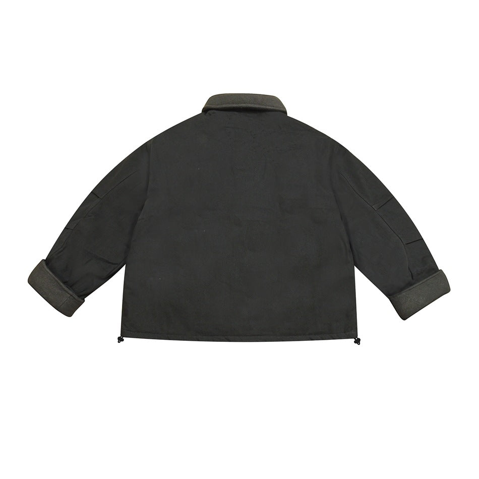 Back view of black jacket flat lay with collar, rolled gray cuffs and hem drawcord toggles