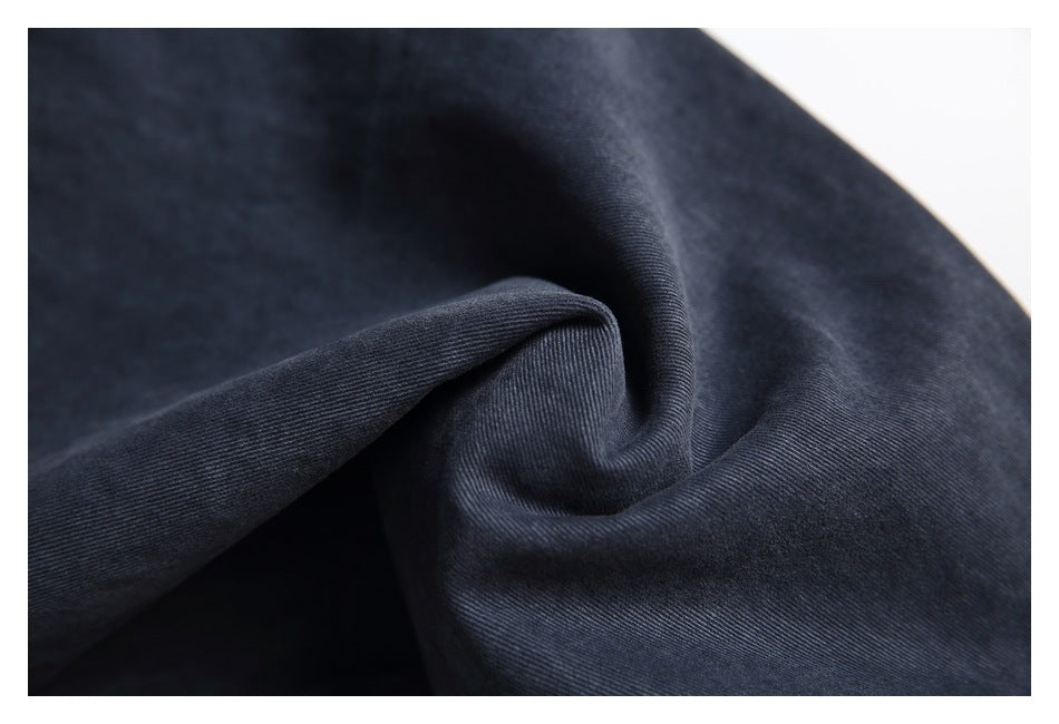 Close-up showing the dark charcoal fabric texture and drape.