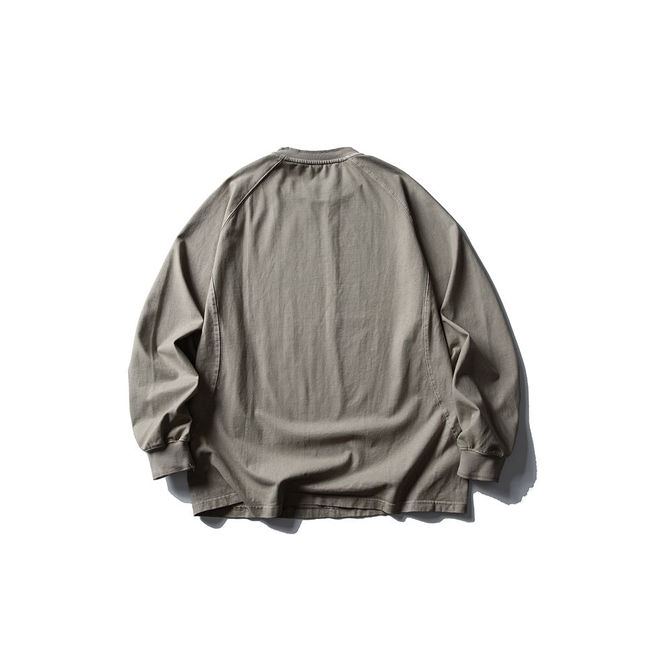 Back view of a gray long-sleeve raglan crewneck top with ribbed cuffs and neckline.