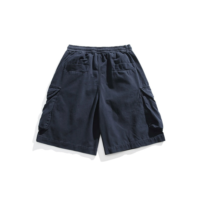 Back view of dark navy cargo shorts with an elastic waist, two rear pockets, and large flap cargo pockets.