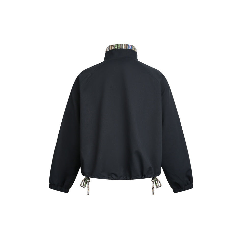Back view of a dark jacket with a patterned collar, elastic cuffs, and patterned drawcords at the hem.
