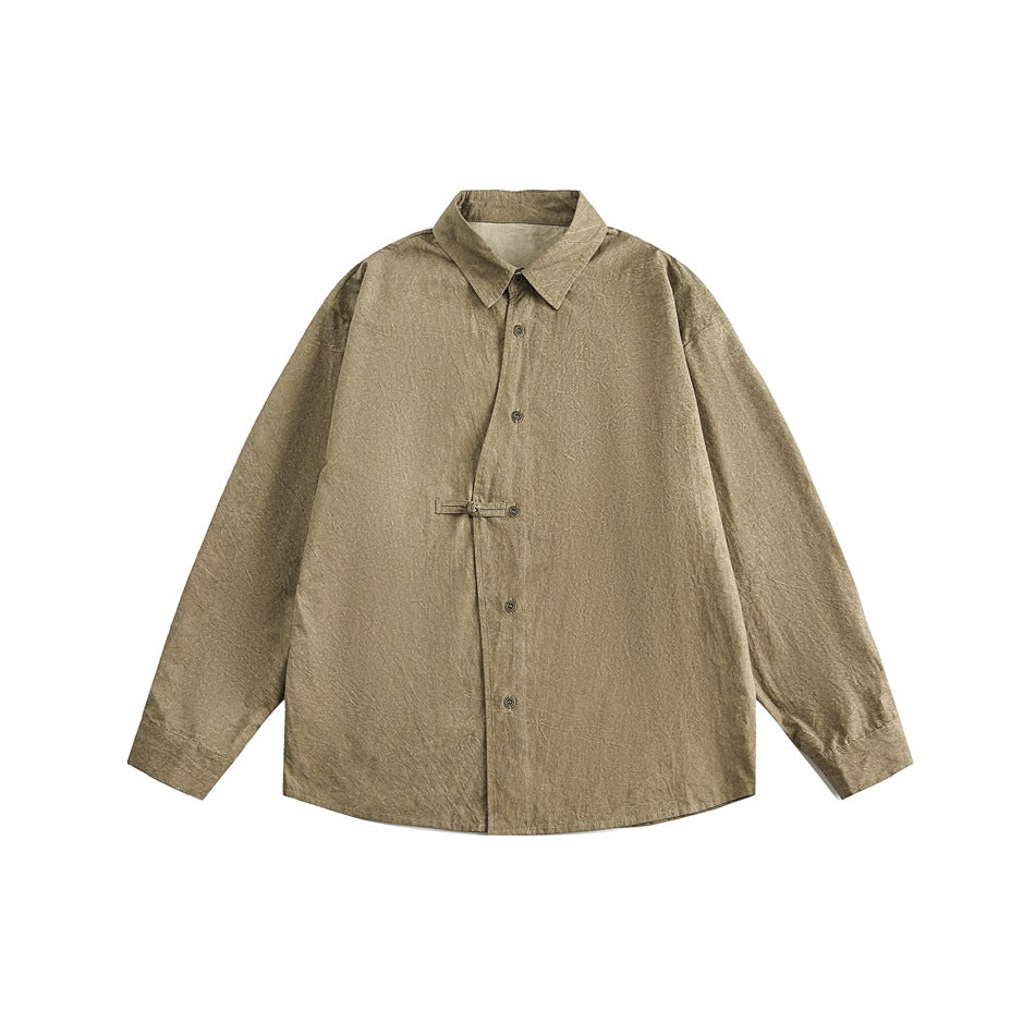 Khaki long-sleeve shirt flat lay with pointed collar, asymmetric button placket and toggle loop closure