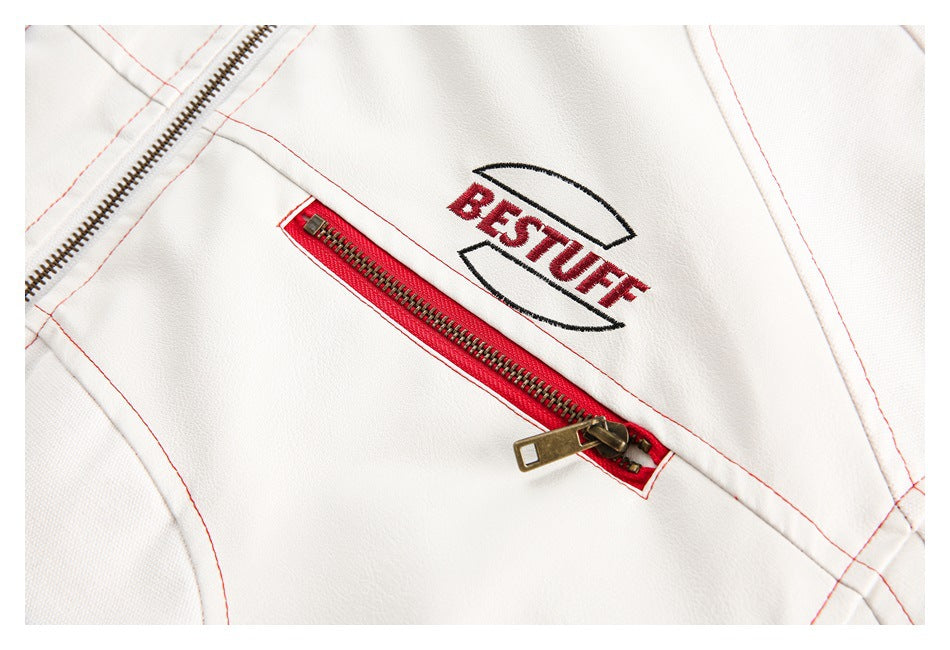 Close-up of the white jacket's red-trimmed zipper and embroidered BESTUFF artwork.