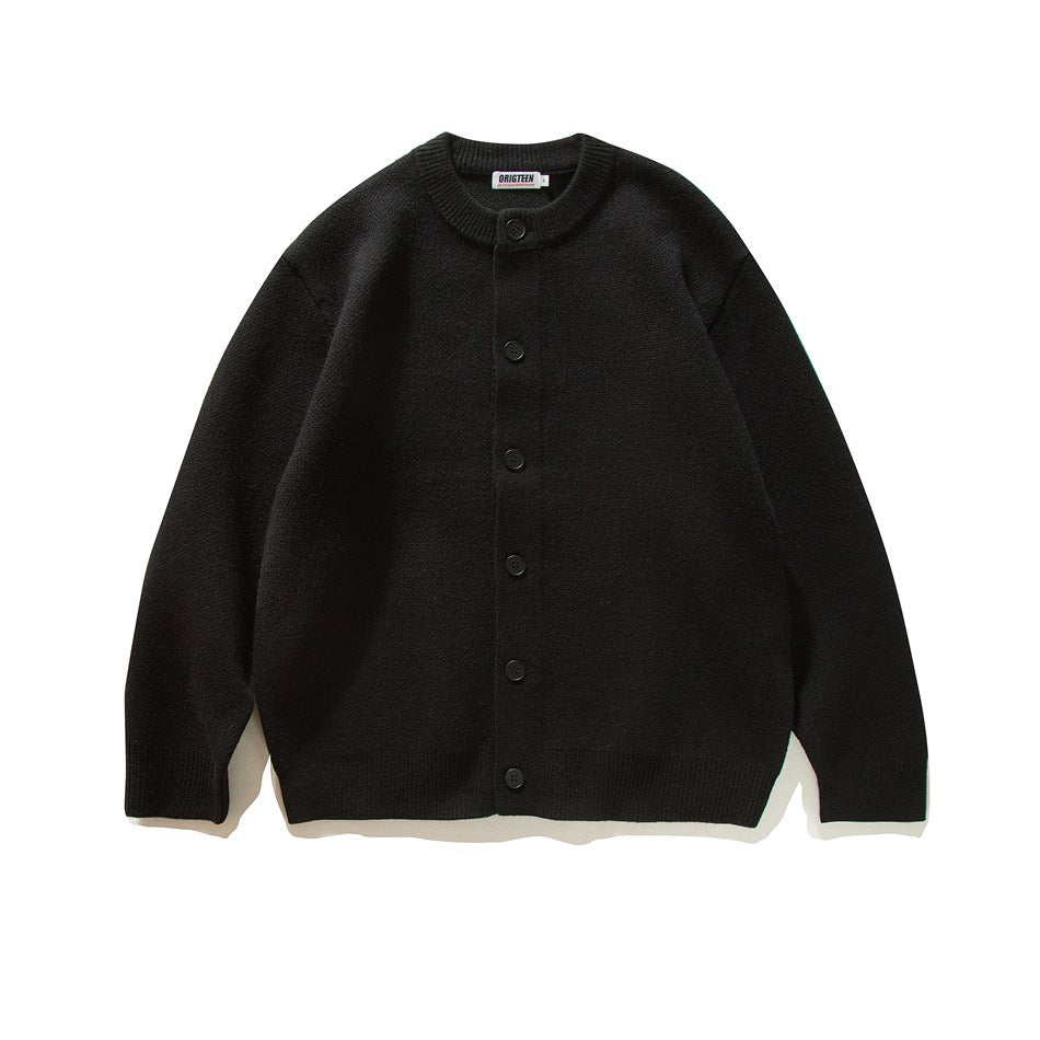 Black button-front knit cardigan with ribbed round neckline, cuffs and hem, flat lay front view