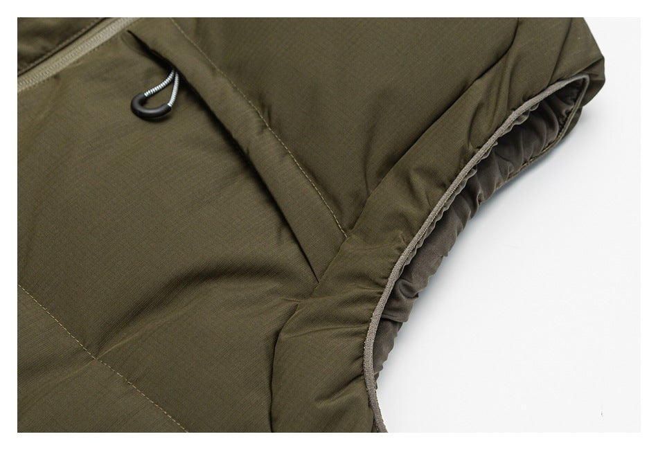 Close-up of an olive jacket's side seam and gathered inner edge.