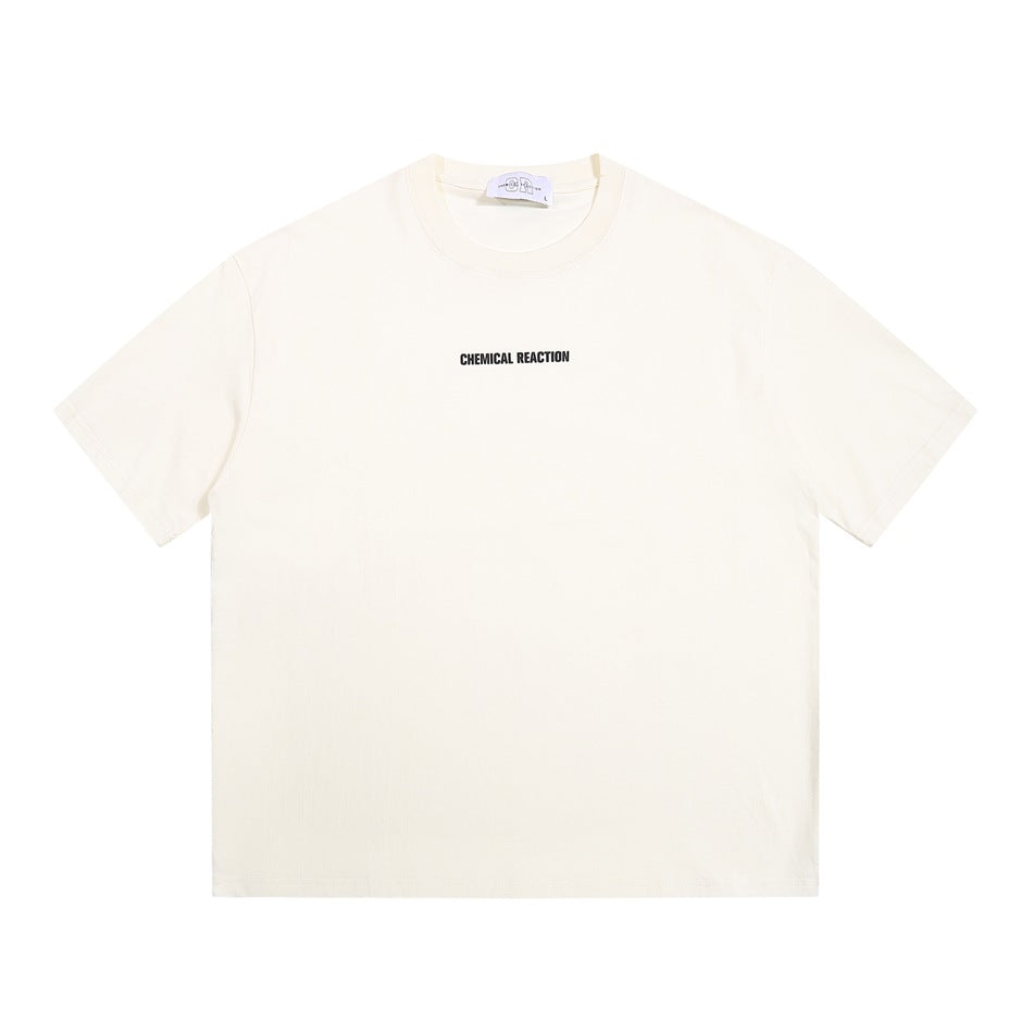 Cream apricot crew-neck short-sleeve T-shirt with small black CHEMICAL REACTION chest print, flat front view