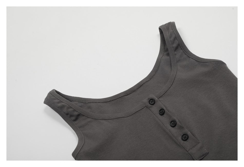 Close-up of the charcoal tank's scoop neckline, shoulder straps, and four-button front placket.
