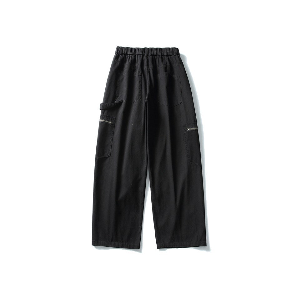 Back view of black wide-leg cargo pants with elastic waist, two patch pockets and zippered side pockets