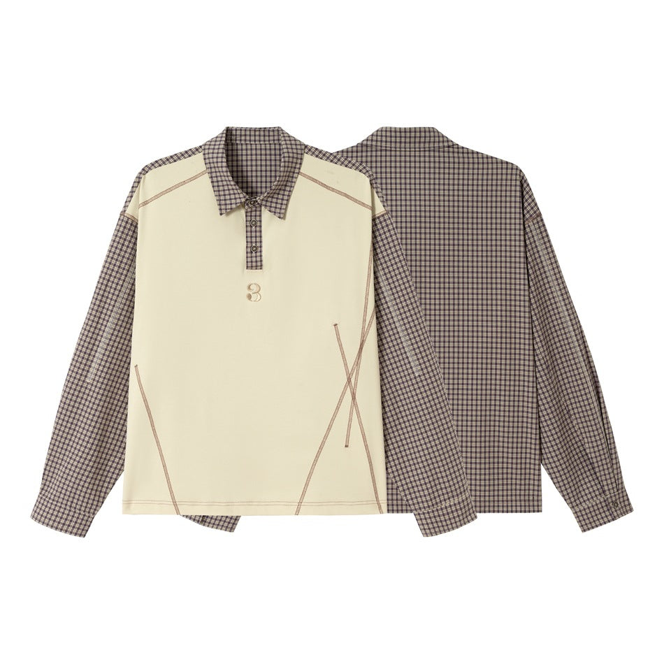 Cream long-sleeve collared top with plaid sleeves, collar and back; front has contrast stitching and a small numeral 3.