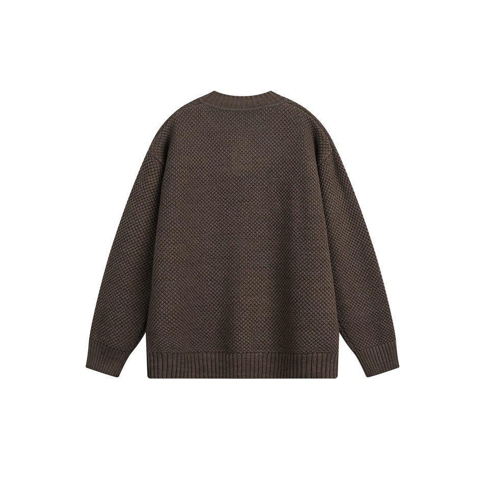 Brown textured knit sweater back view with round neckline and ribbed cuffs and hem