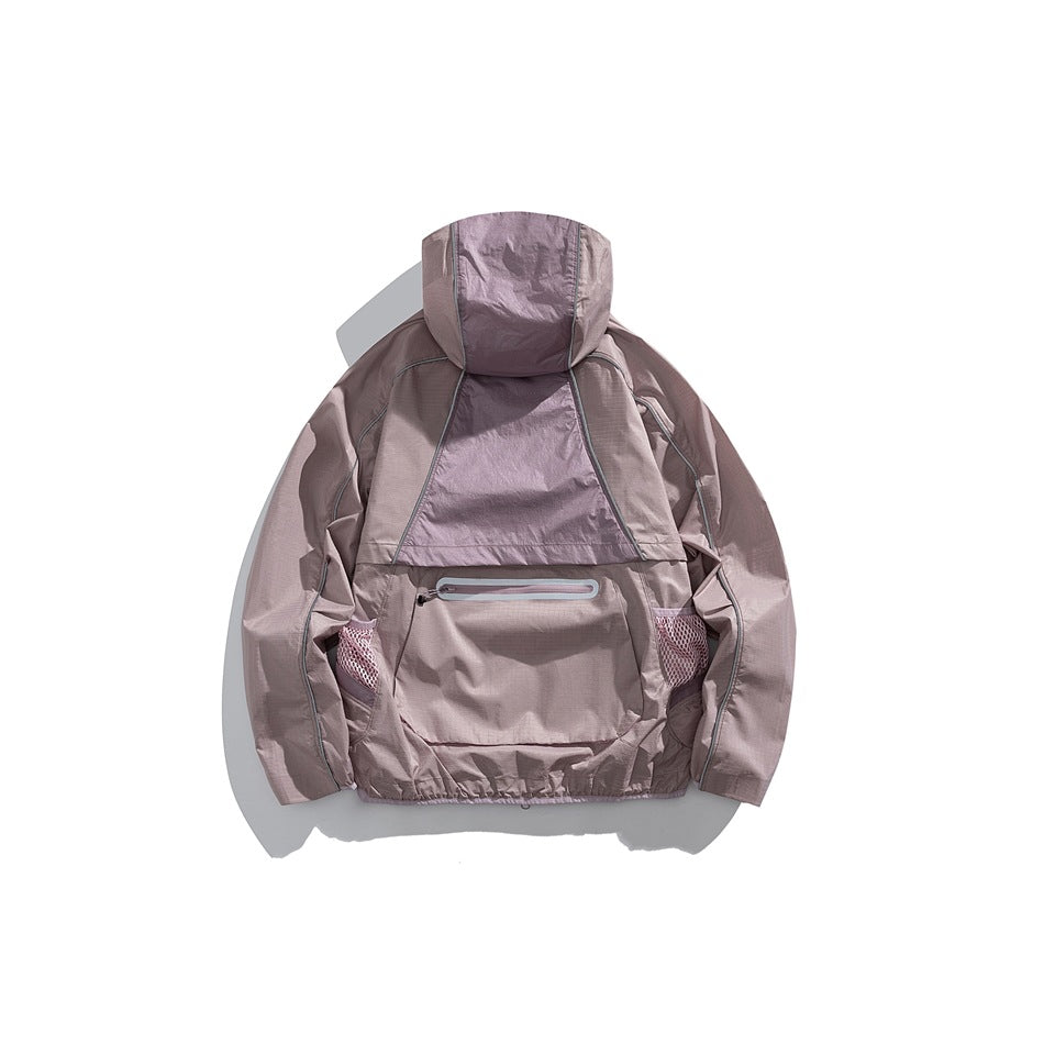 Back view of a dusty mauve hooded jacket with a contrasting center panel, zip pocket, and mesh side pockets.