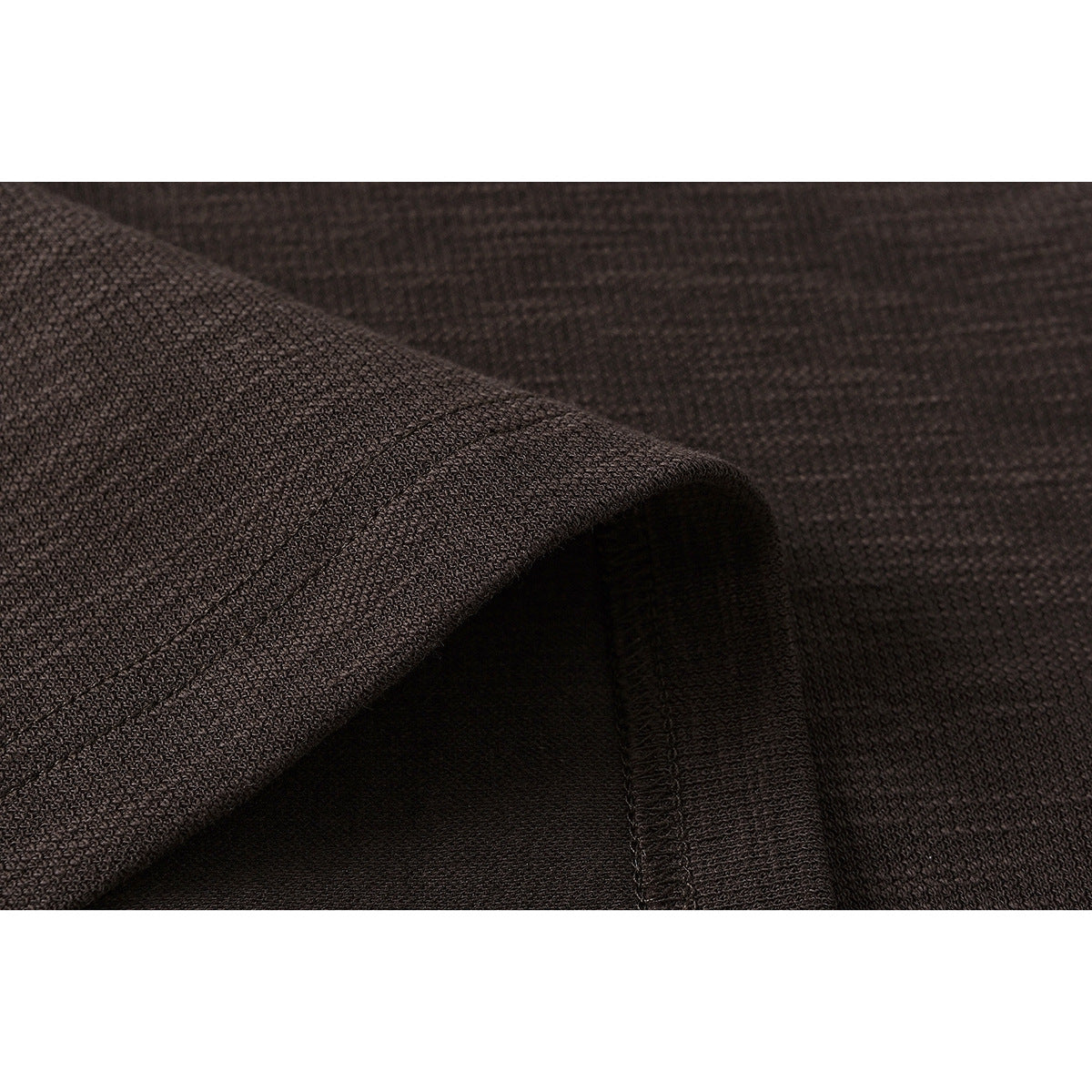 Close-up of dark brown sweatshirt fabric and a stitched seam.