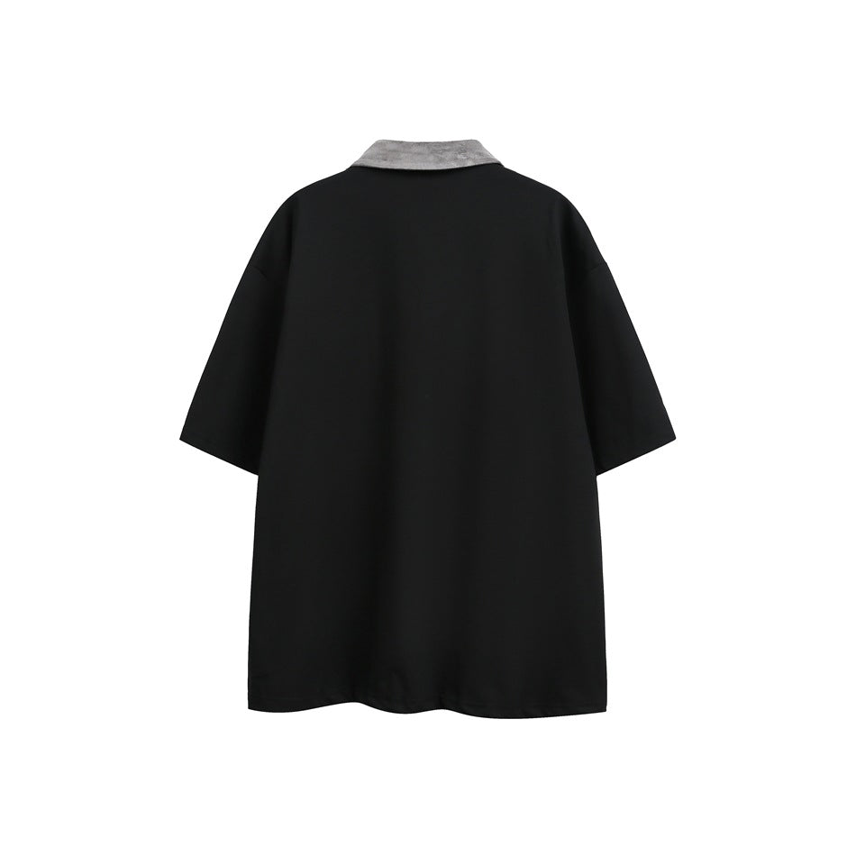 Back view of a black short-sleeve polo with a gray collar.