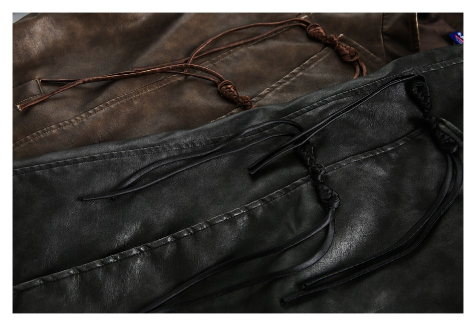 Close-up of brown and black jackets with long braided leather-look ties and knotted ends.