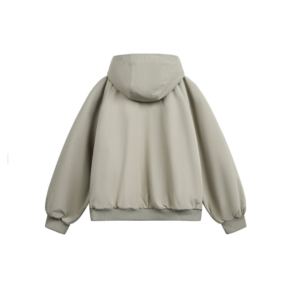 Back view of a beige hooded jacket with voluminous sleeves and ribbed cuffs and hem, shown against white.