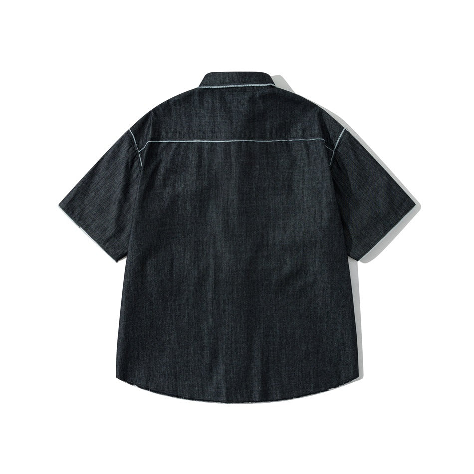 Back view of a charcoal short-sleeve denim shirt with pale contrast stitching across the shoulders.