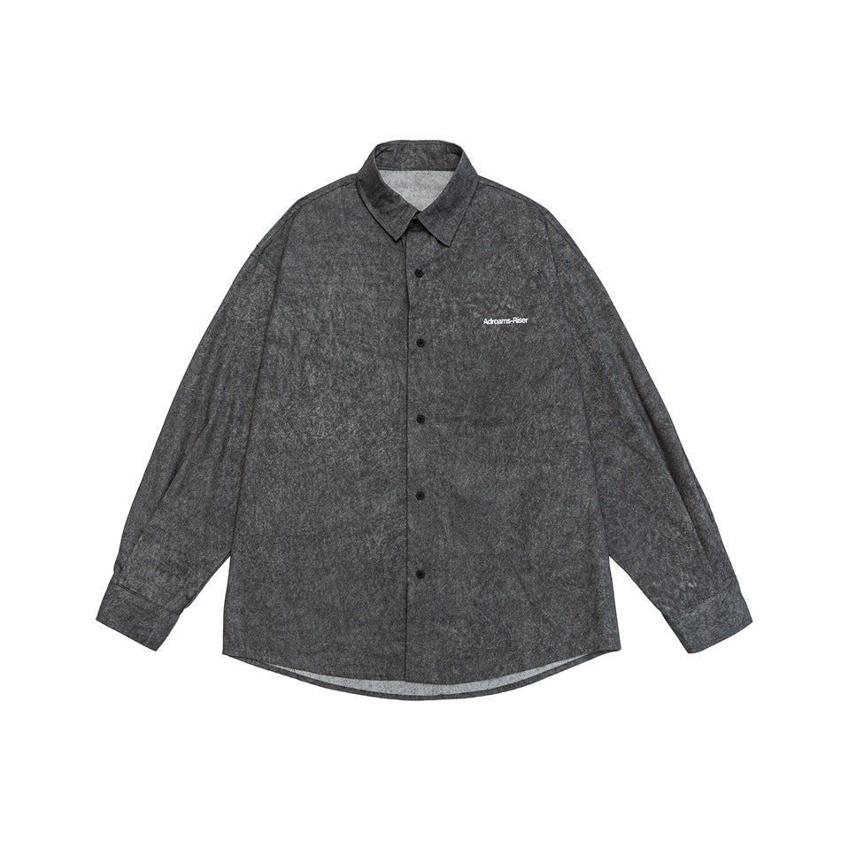 Front view of a dark charcoal mottled long-sleeve button-up shirt with a pointed collar and small chest lettering.