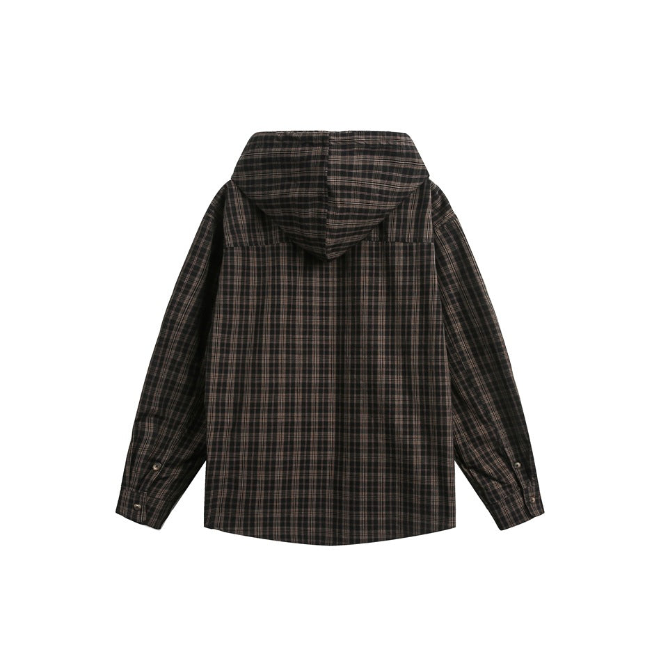 Back view of a dark charcoal plaid hooded shirt jacket laid flat, with long sleeves and buttoned cuffs.
