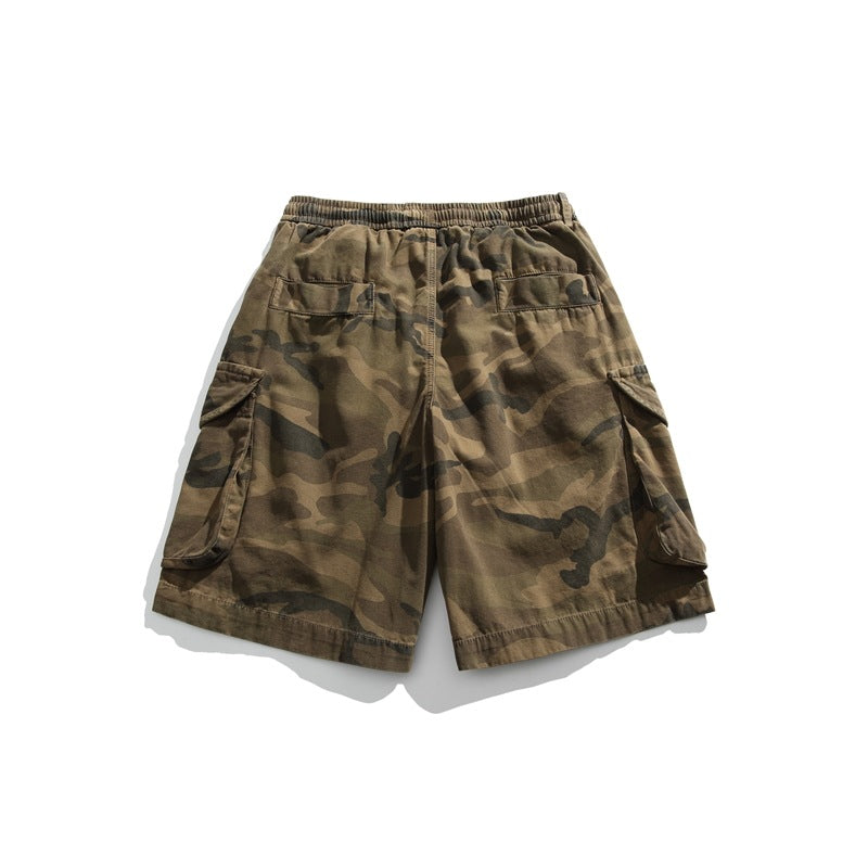 Back view of brown camouflage cargo shorts with an elastic waist, two rear pockets, and large flap cargo pockets.