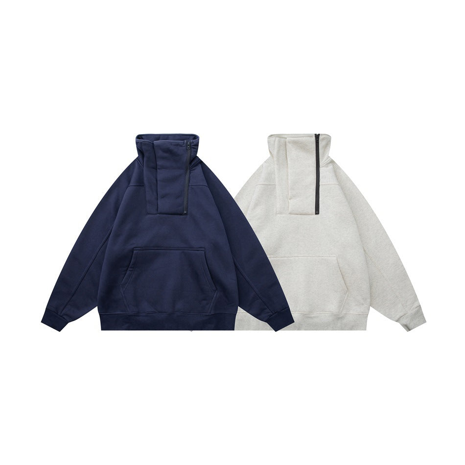 Front views of quarter-zip pullover sweatshirts with kangaroo pockets in navy and light gray.
