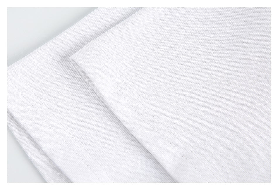 Close-up of white fabric showing folded edges and parallel stitching.