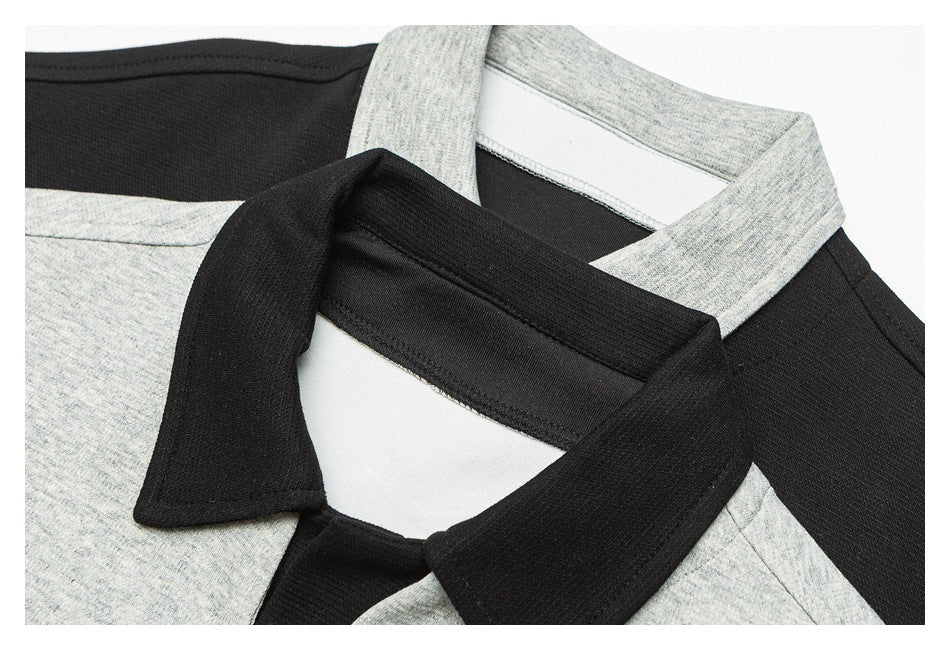 Close-up of overlapping black and heather-gray collars, showing the neckline and inner collar construction.