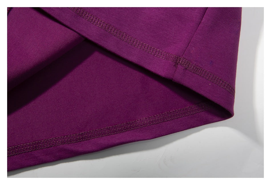 Close-up of the purple shirt's folded hem and visible stitching.