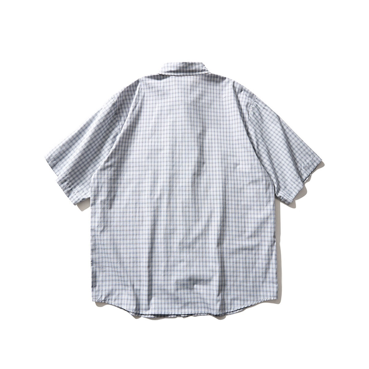 Back view of a light blue plaid short-sleeve shirt laid flat, showing the collar, shoulders and curved hem
