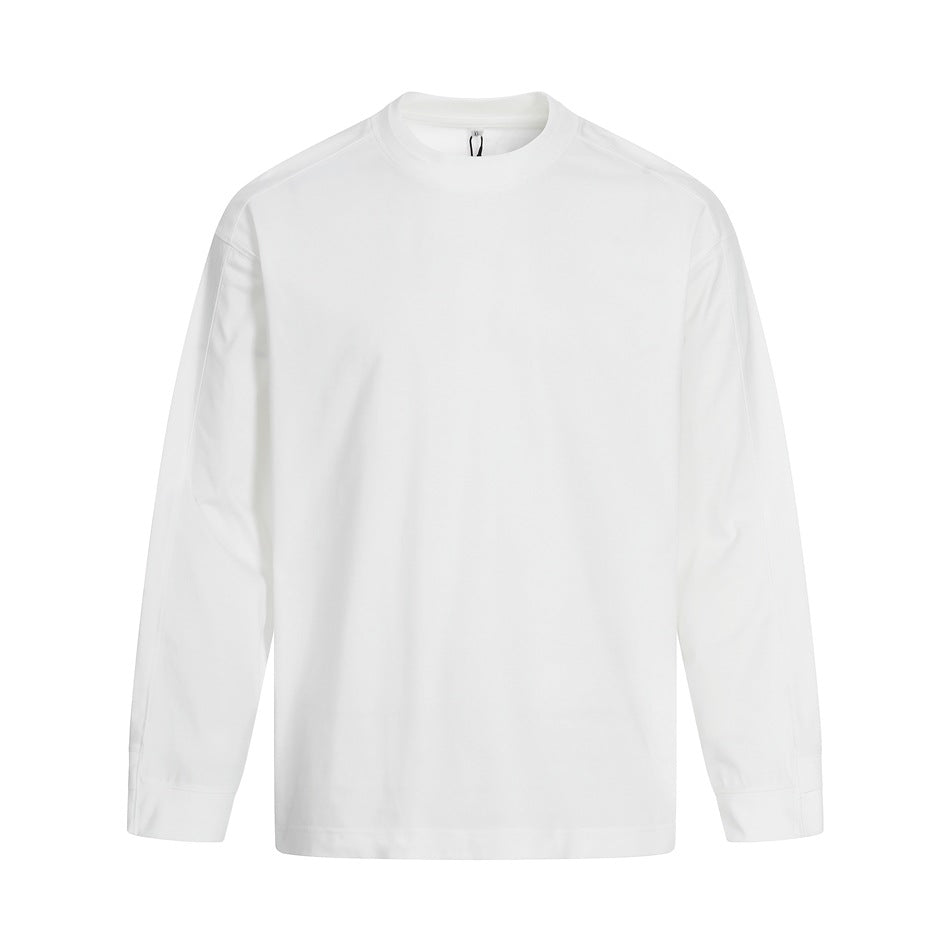 White long-sleeve crew-neck top, flat front view with drop shoulders and wide cuff hems