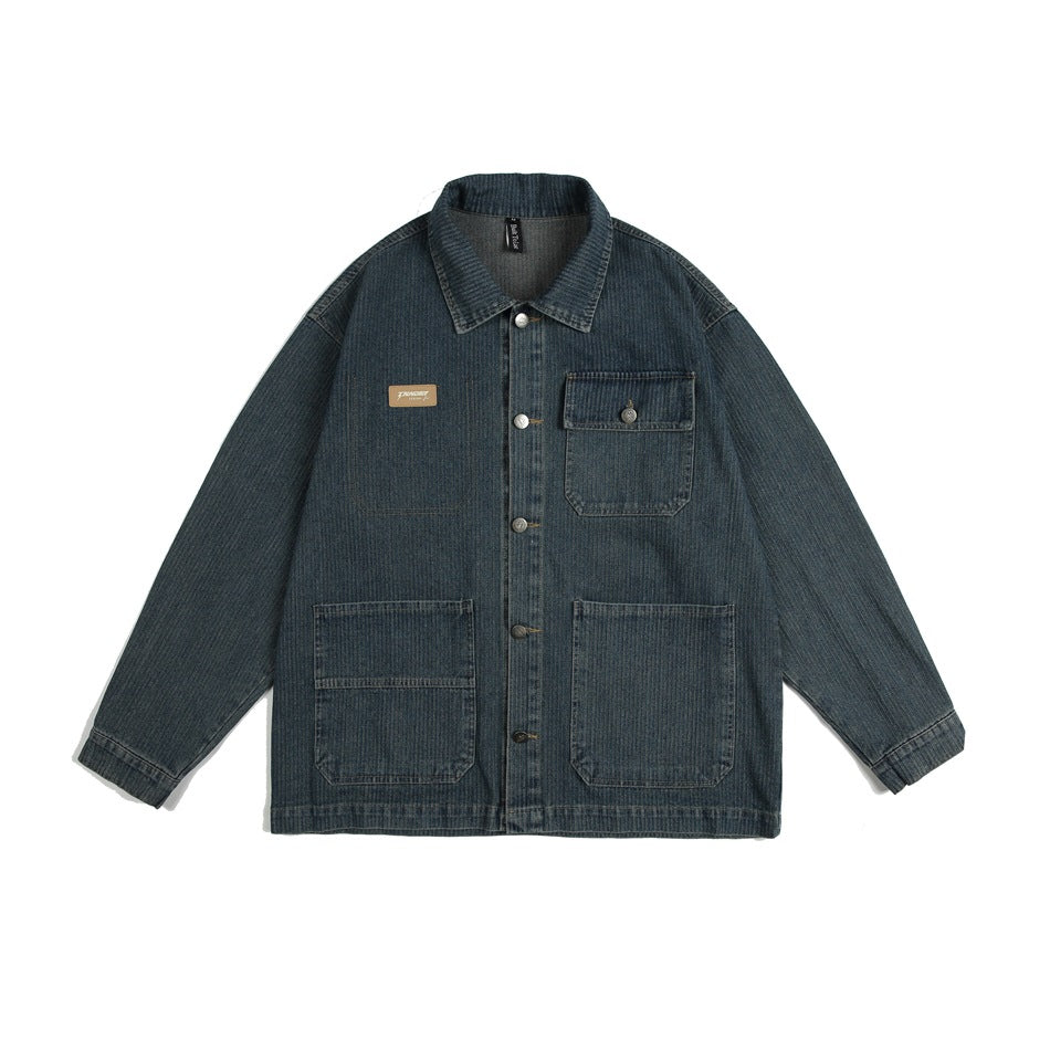 Dark blue pinstripe-texture denim jacket with button front, chest flap pocket and two large lower patch pockets, flat view