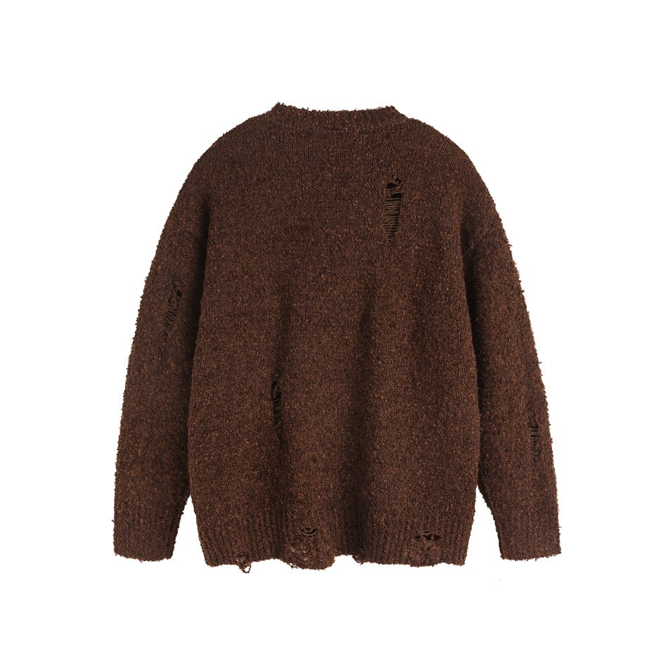 Back view of a dark brown sweater with distressed slits and a ribbed hem.
