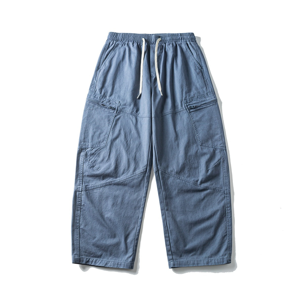 Blue wide-leg cargo pants with elastic drawstring waist, zip side pockets and paneled knees, flat lay front view