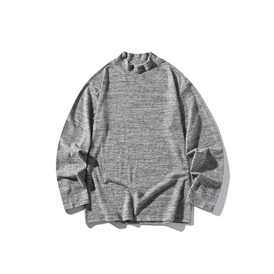 Heather gray long-sleeve mock-neck top shown laid flat against a white background.