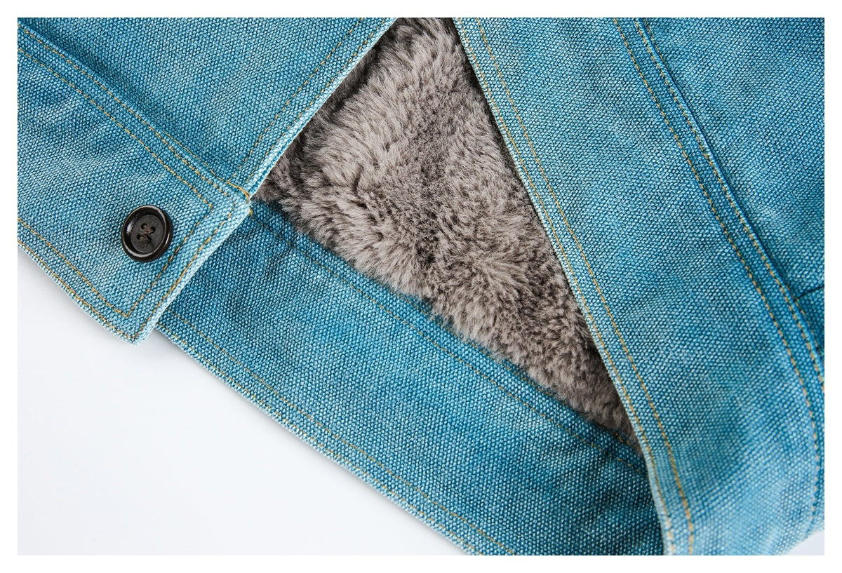 Blue woven garment opened to reveal a thick gray faux-fur lining beside a dark button.