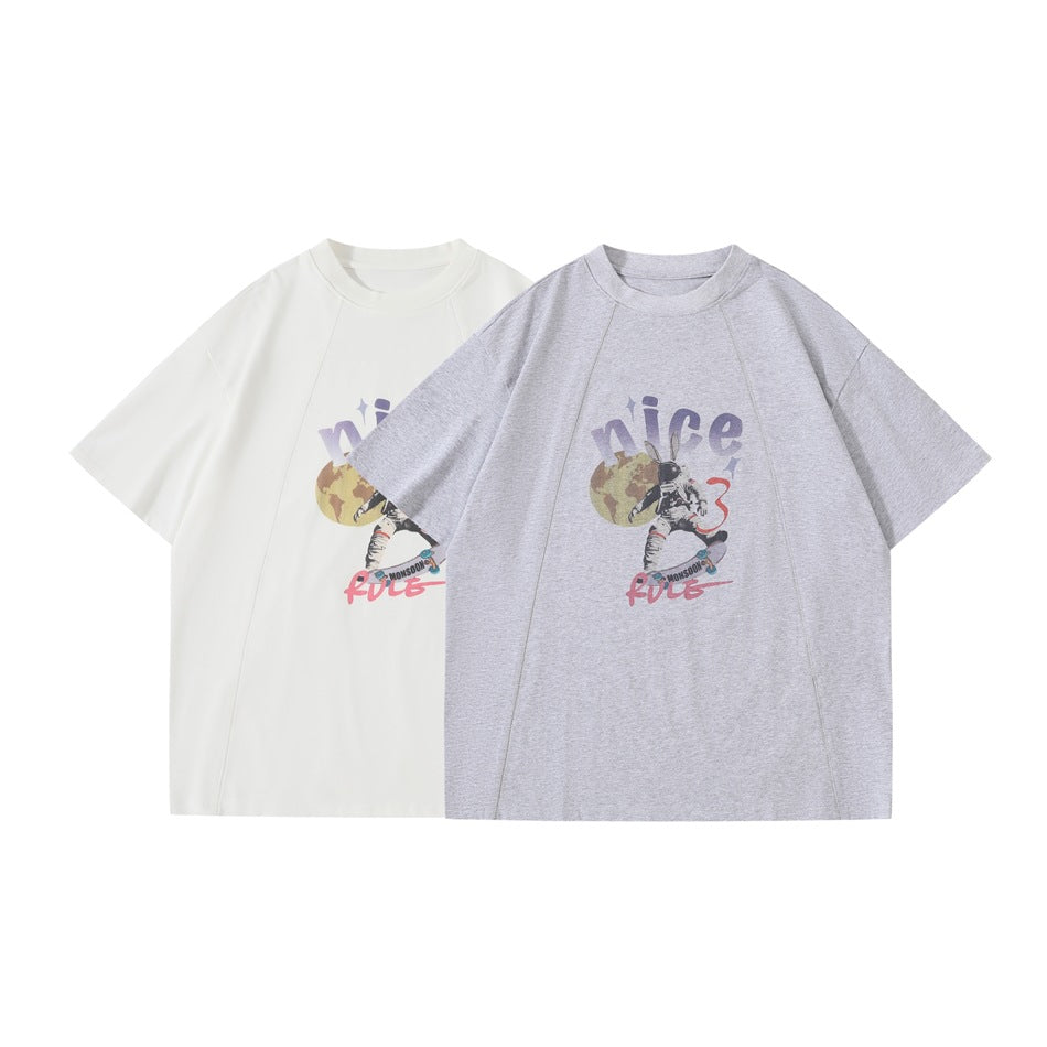 White and heather-gray short-sleeve crew-neck T-shirts with matching astronaut rabbit graphics, shown side by side.