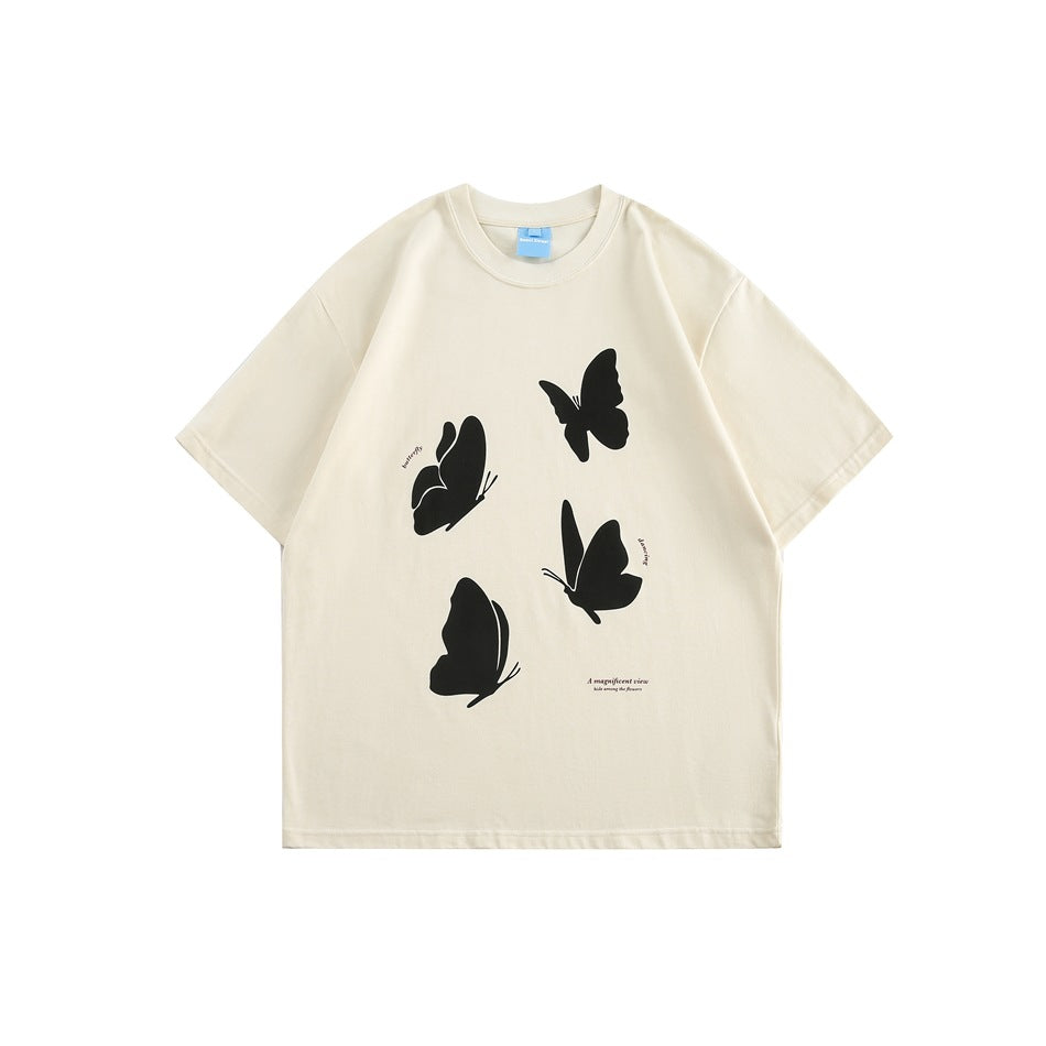 Apricot cream short-sleeve crewneck T-shirt with four black butterfly silhouettes printed on the front
