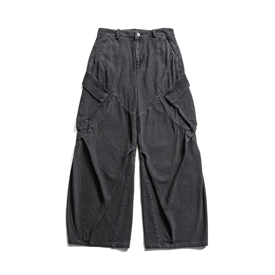 Black wide-leg denim cargo pants with side flap pockets and curved seams, front flat lay