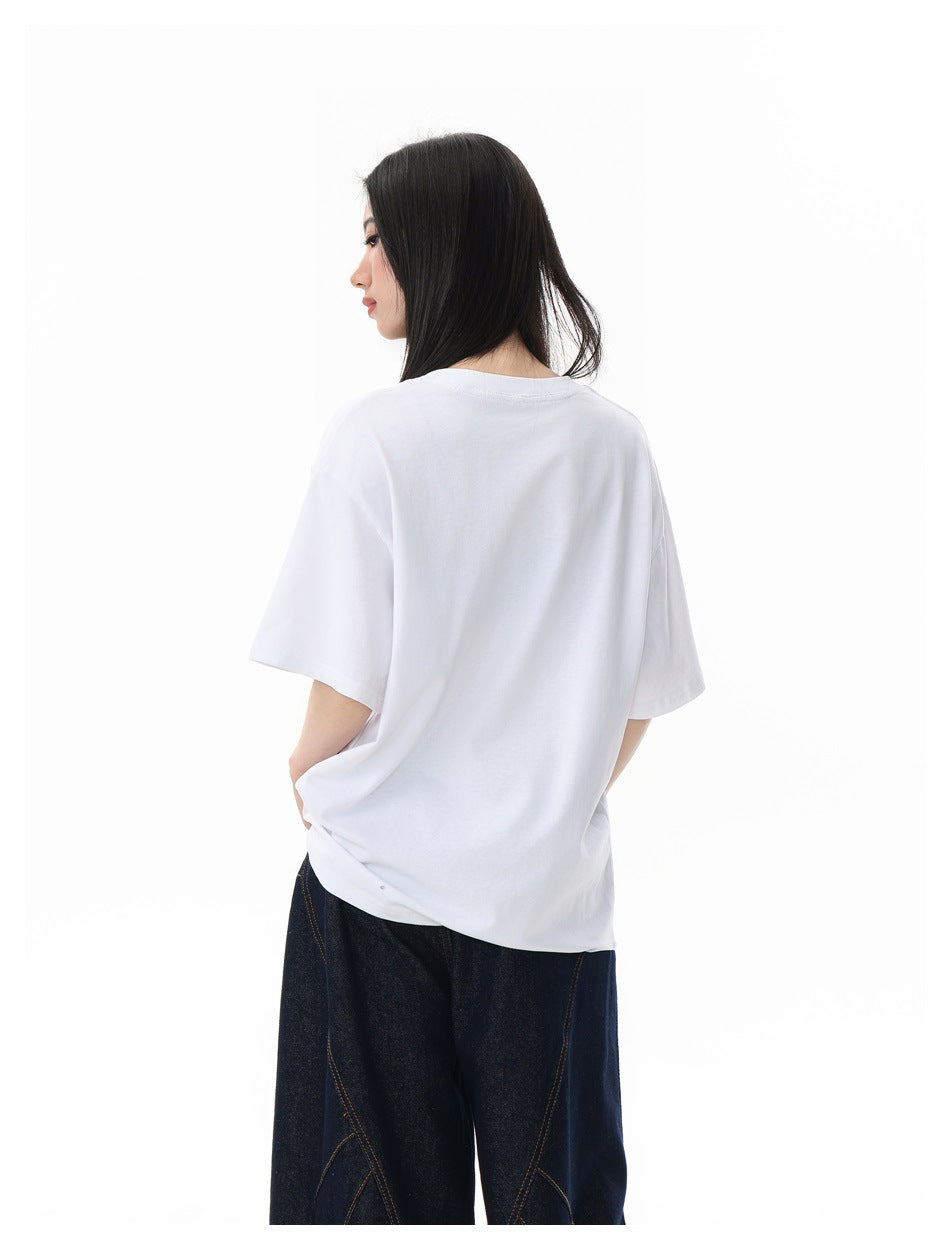 Model shown from behind in a plain white oversized T-shirt and dark jeans.