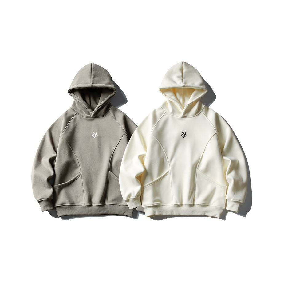 Two hoodies shown from the front, one taupe and one ivory, with hoods and front pockets.