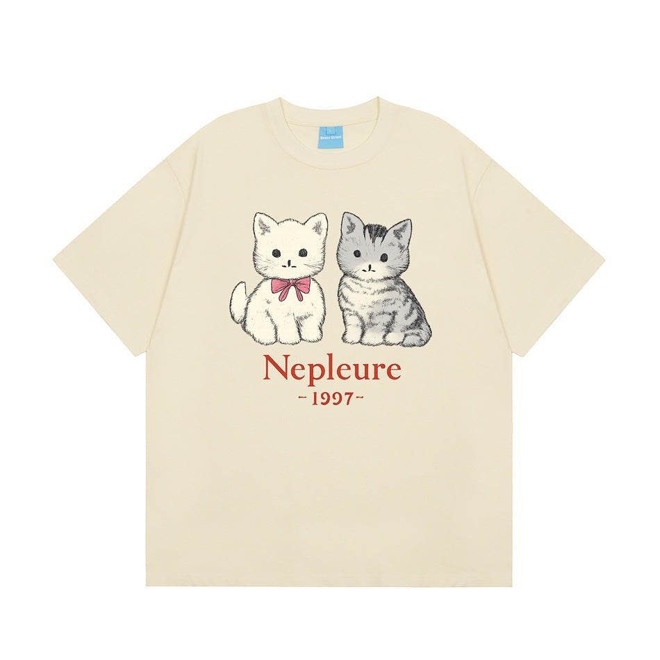 Cream yellow short-sleeve T-shirt with two kitten print and red Nepleure 1997 text, flat front view