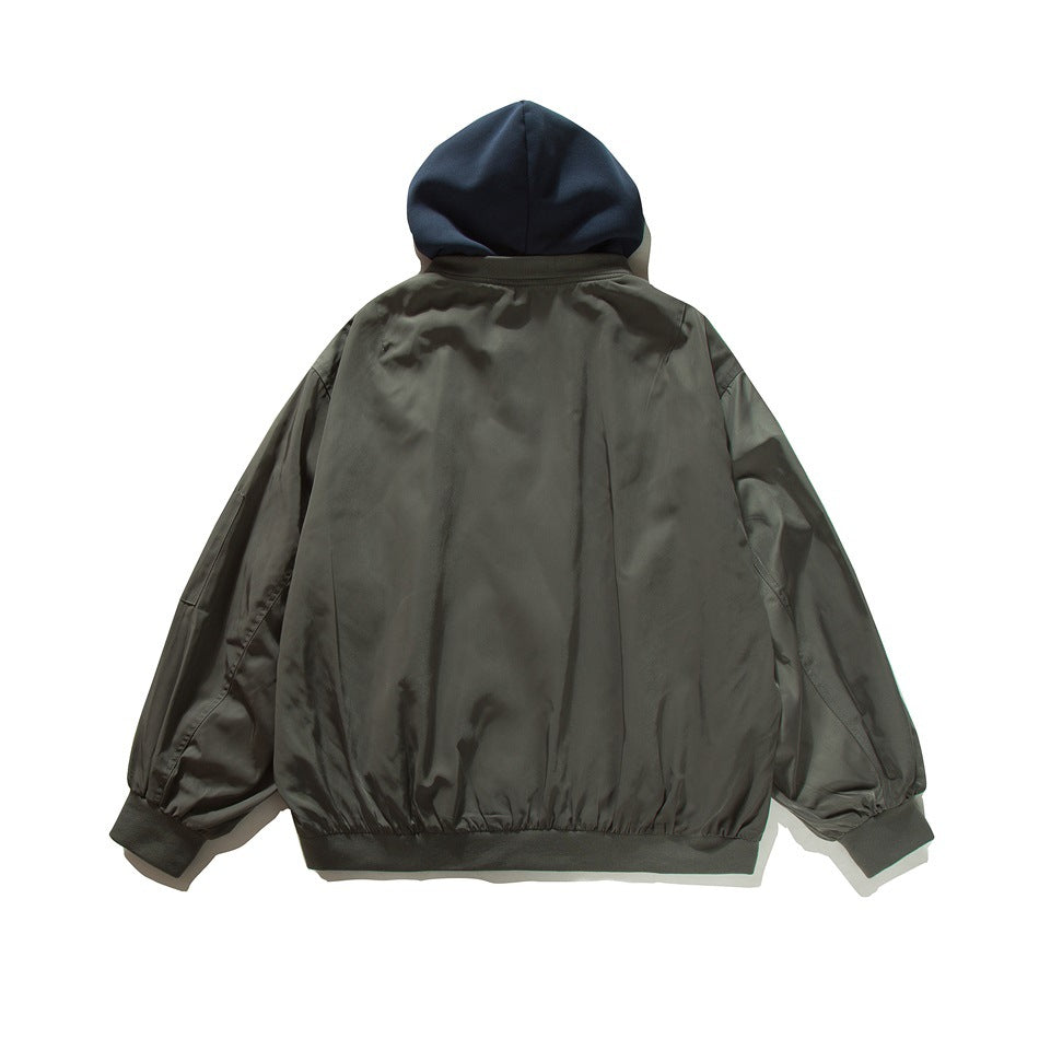 Back view of a gray-olive bomber jacket with a navy hood, gathered cuffs and hem.