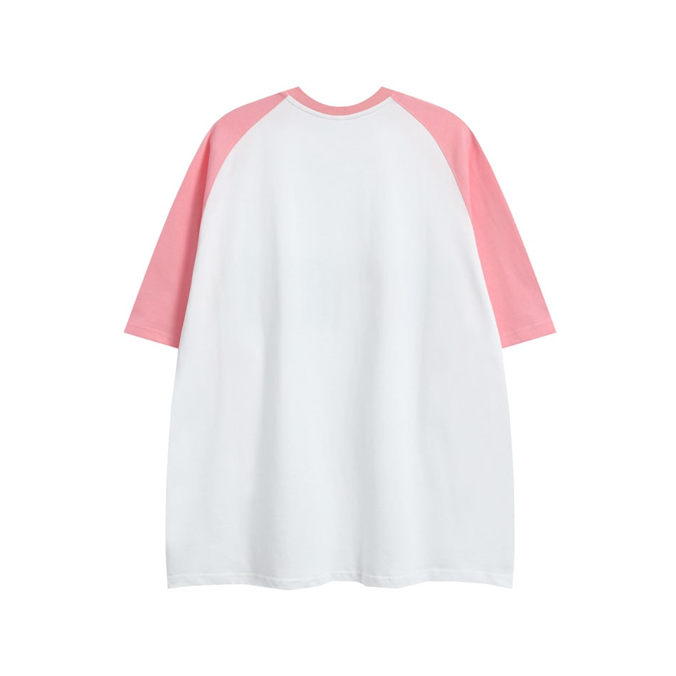 Back view of a plain white raglan T-shirt with pink sleeves.