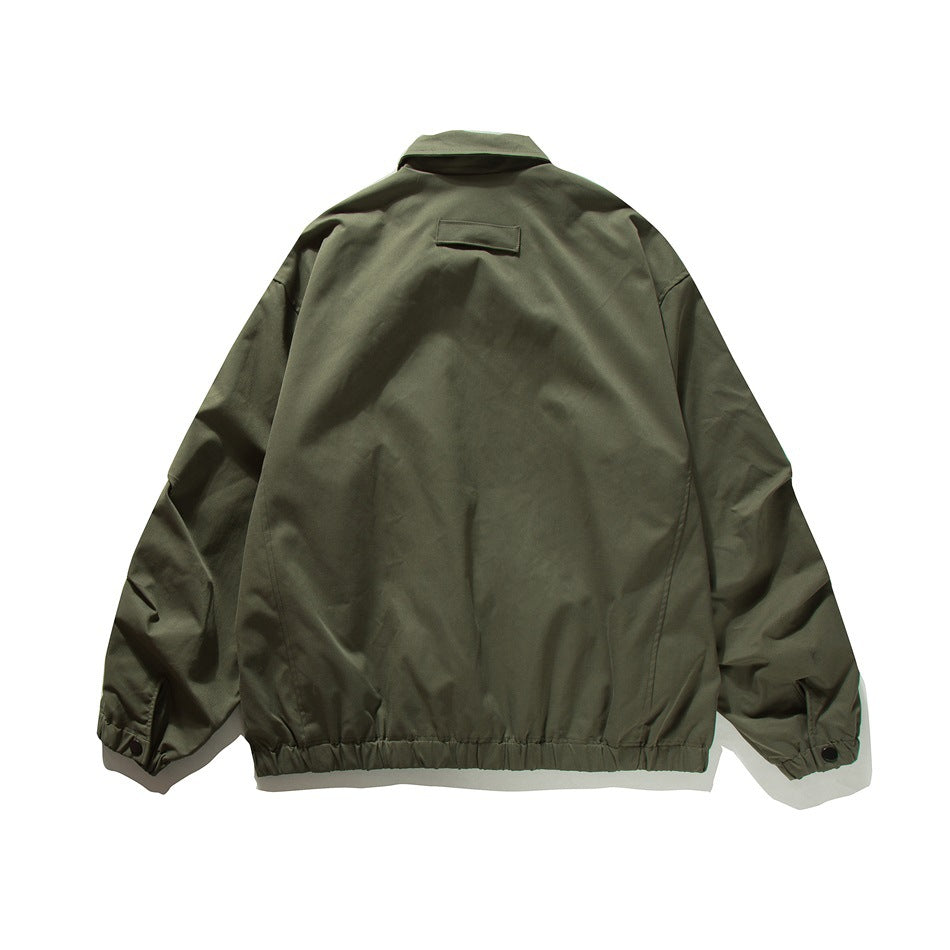 Back view of an olive-green jacket with a small upper-back tab, elastic hem and snap cuffs.