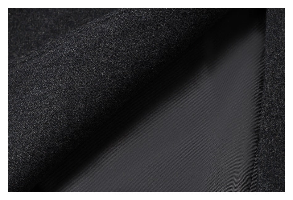 Close-up showing dark charcoal outer fabric beside smooth black lining.