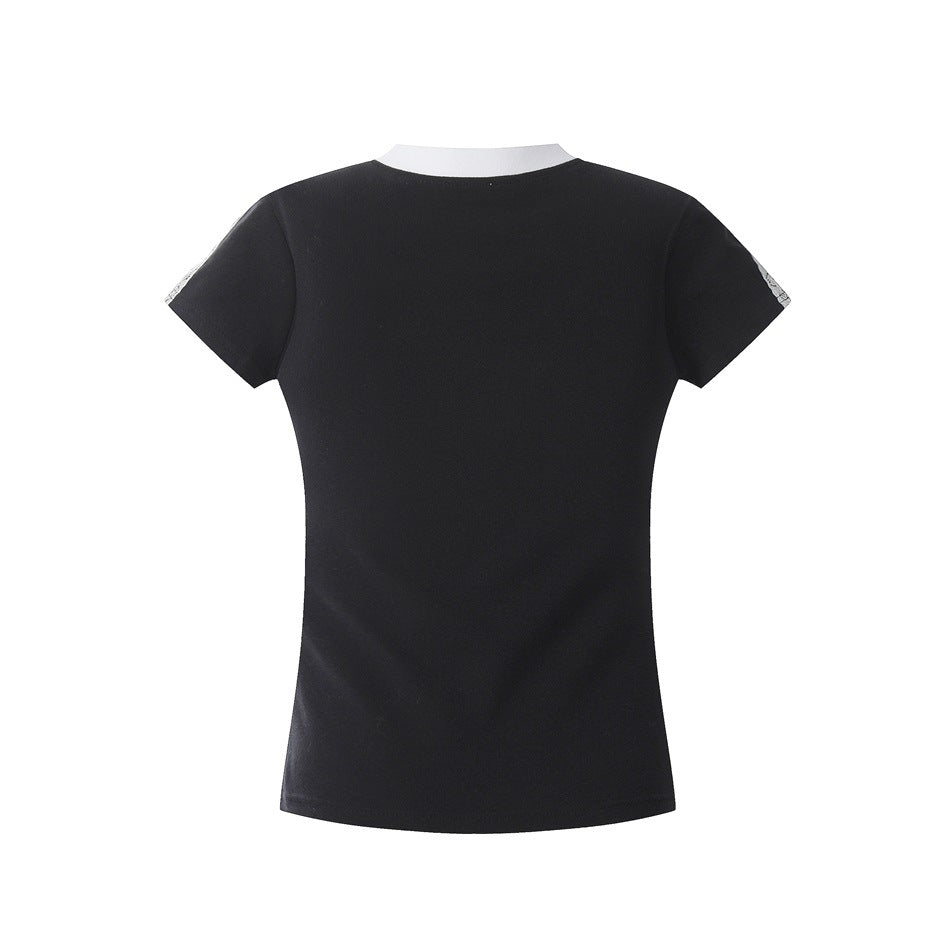 Back of a black fitted short-sleeve top with a white crew neckline and light sleeve-edge trim.
