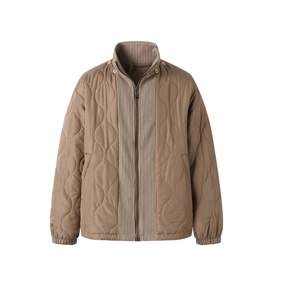 Front view of a tan quilted jacket with a rib-knit zip front, stand collar, and elastic cuffs.