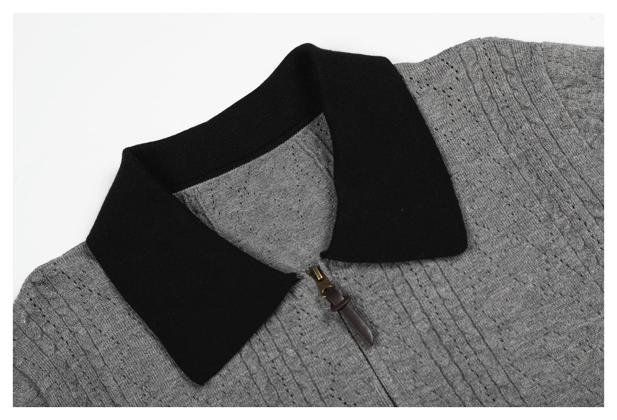 Close-up of the gray knit top's black collar and short front zipper with a brown pull.