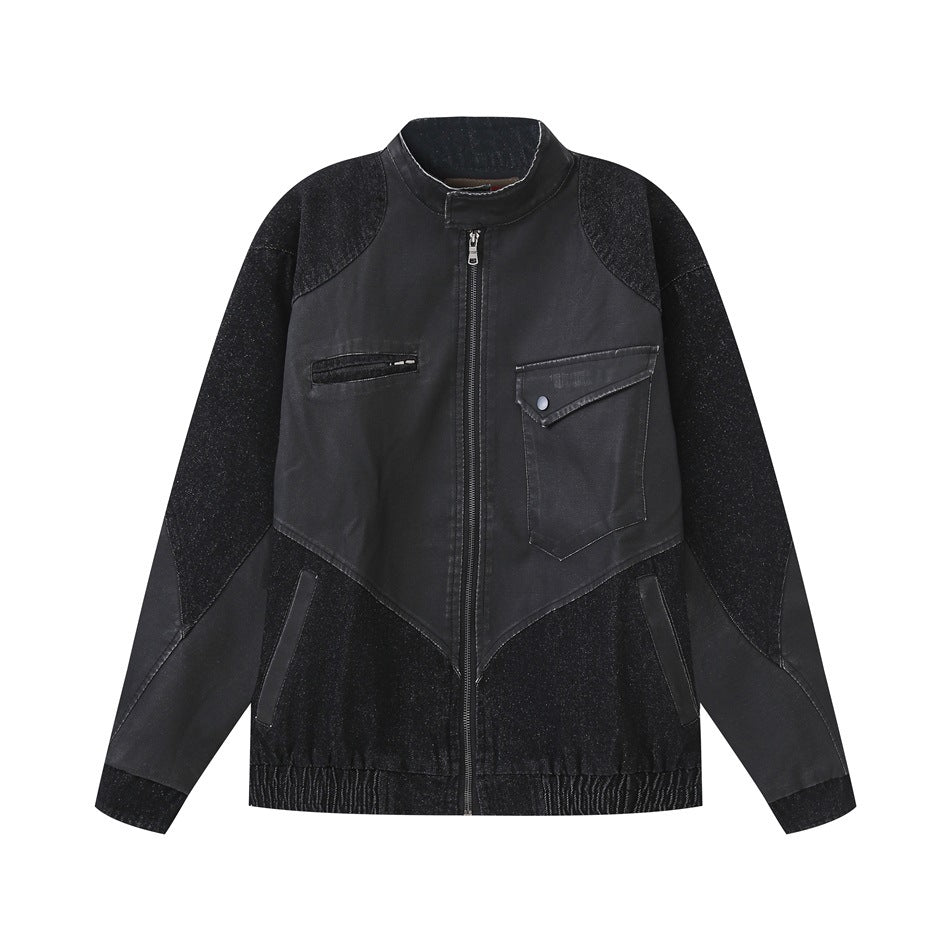 Black stand-collar zip jacket with smooth and textured denim-like panels, chest pockets and elastic hem, flat lay front view